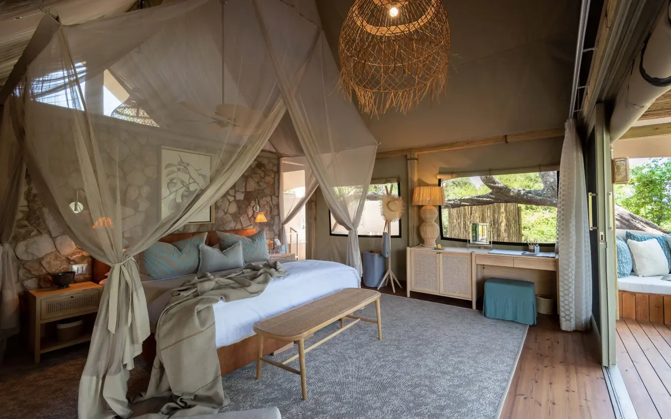 Spacious bedroom with four-poster canopy bed and outdoor views, Mpala Jena, Victoria Falls, Zimbabwe