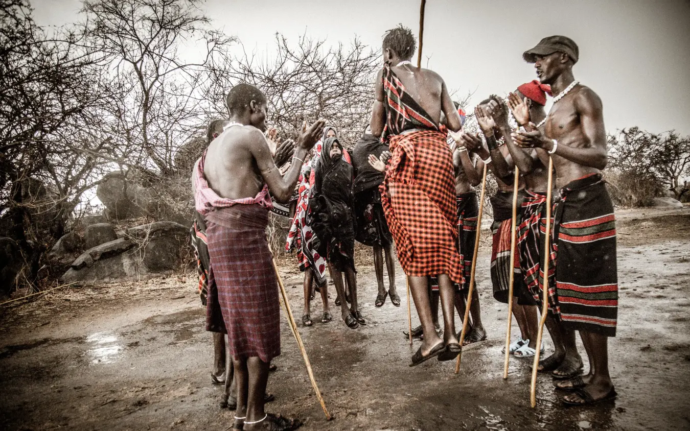 Local guides demonstrating traditional hunting techniques with spears, Mwiba Lodge, Serengeti National Park, Tanzania