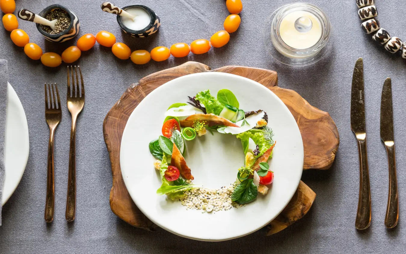 Plated fine dining dish with vegetables and garnish setup, Mwiba Lodge, Serengeti National Park, Tanzania