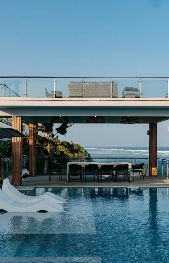 Infinity pool overlooking coastal cliffs and ocean beneath modern architecture, My Amani, Kilifi, Kenya