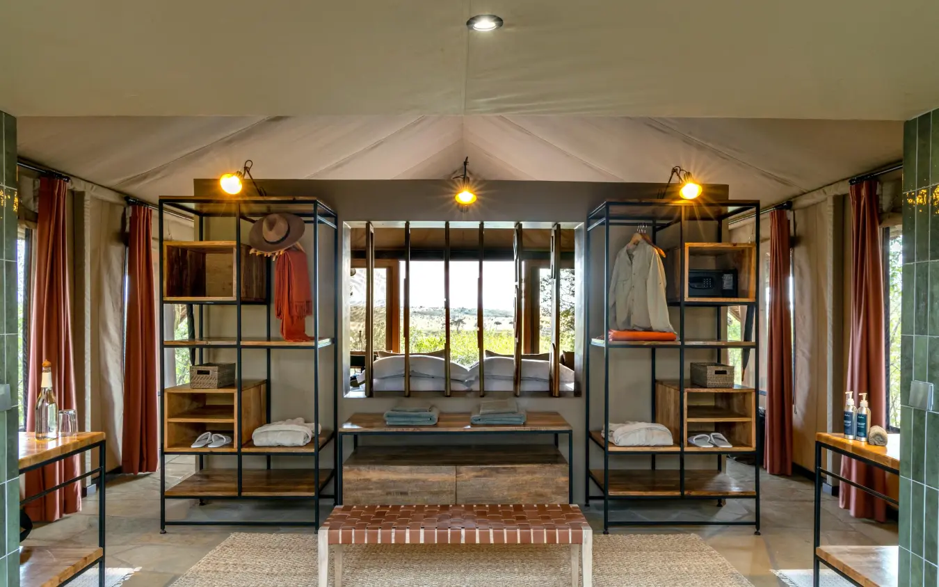 Luxury bedroom with four-poster bed and landscape views, Naboisho Camp, Maasai Mara, Kenya