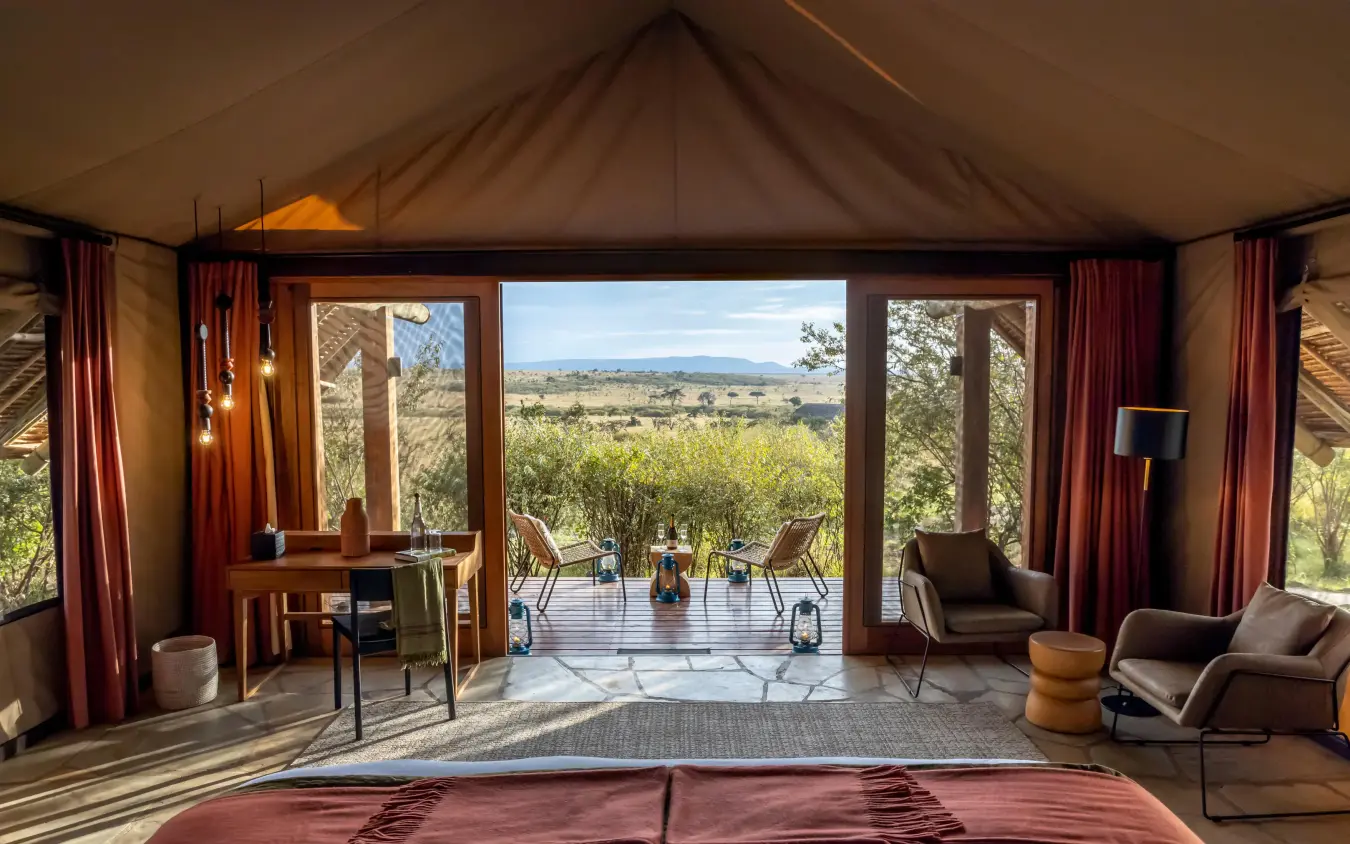 Luxury tent bedroom with open views across savanna landscape, Naboisho Camp, Maasai Mara, Kenya
