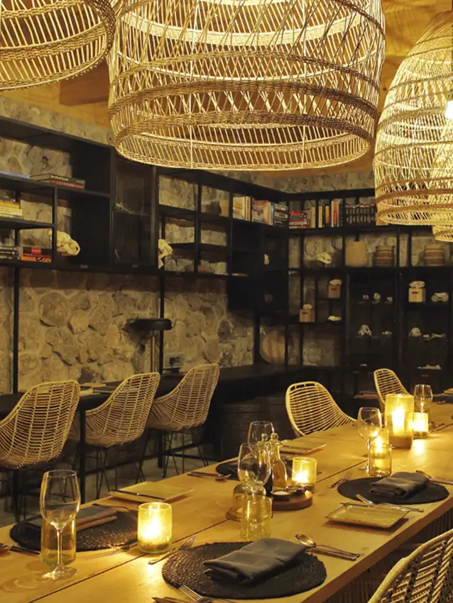Fine dining restaurant with woven pendant lights and display shelving, Namiri Plains, Serengeti National Park, Tanzania