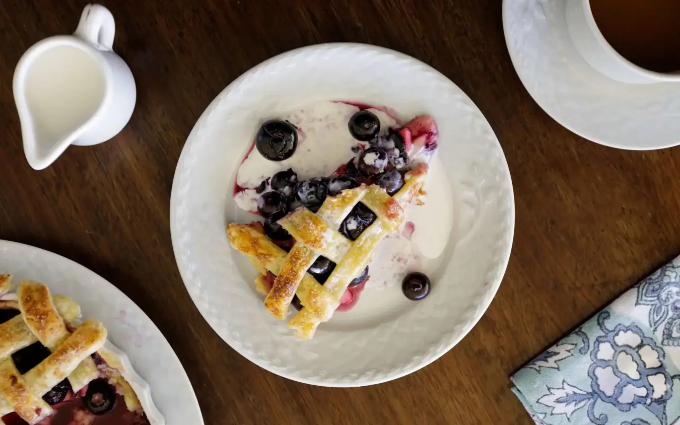 Gourmet waffle dessert plate with berries and cream sauce overhead view, Nderit House, Kilifi, Kenya