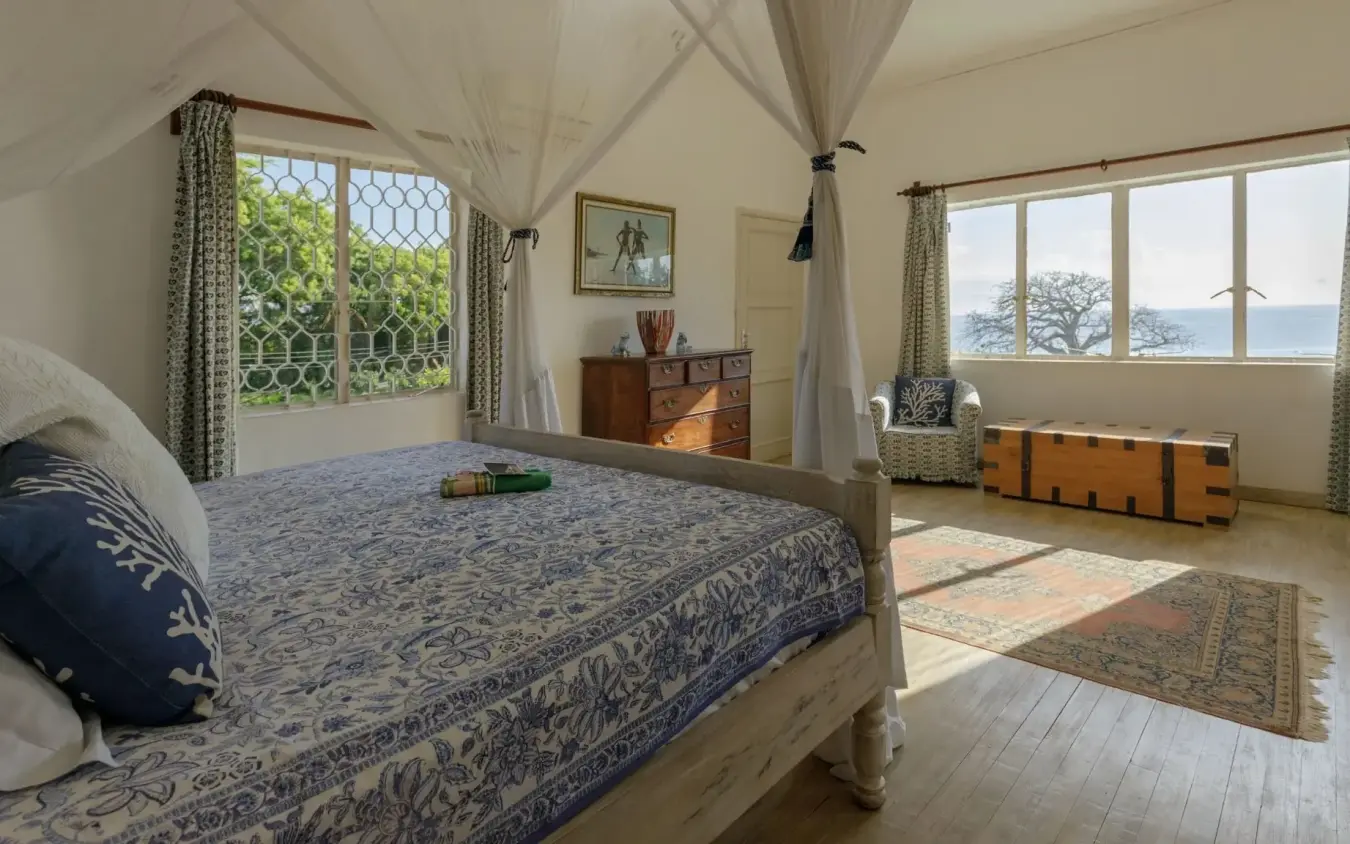 Canopy bed with valley views in luxury safari lodge bedroom, Nderit House, Kilifi, Kenya