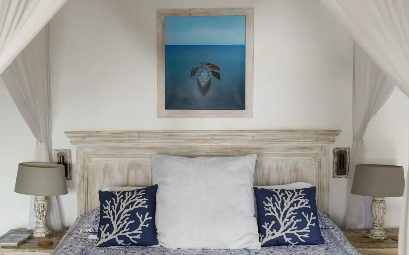 Coastal bedroom with nautical decor and ocean artwork above bed, Nderit House, Kilifi, Kenya
