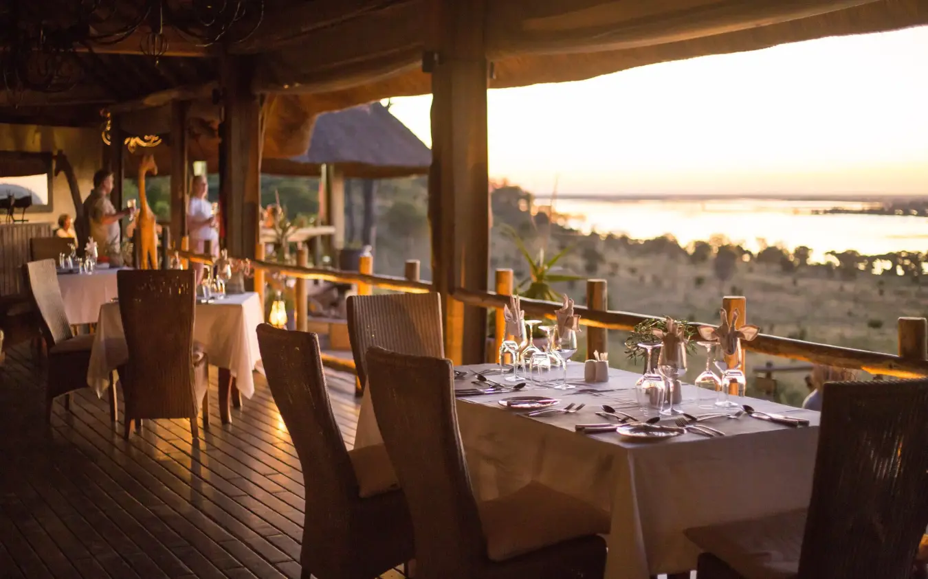 Elevated dining deck overlooking river valley at golden hour, Ngoma Safari Lodge, Chobe, Botswana