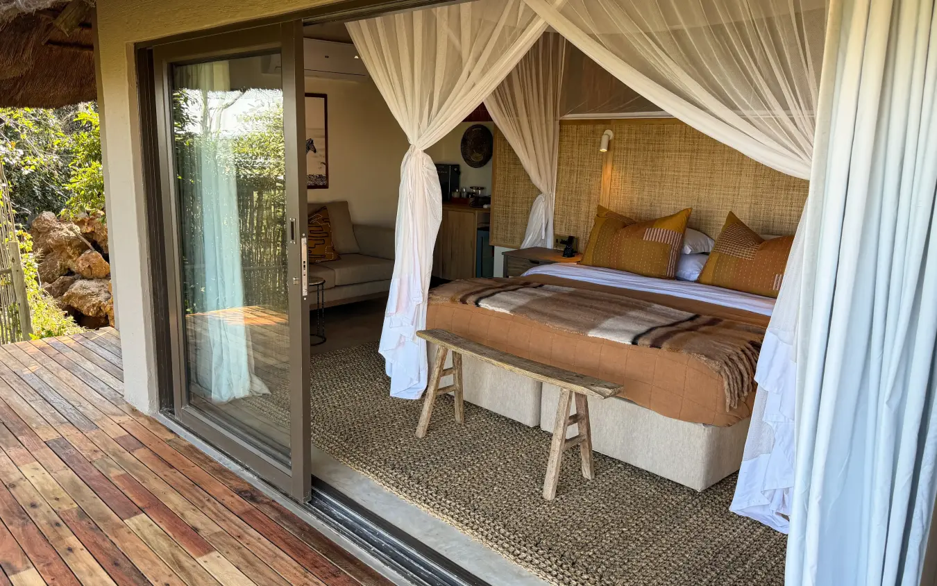 Luxury bedroom suite with canopy bed and private wooden deck, Ngoma Safari Lodge, Chobe, Botswana