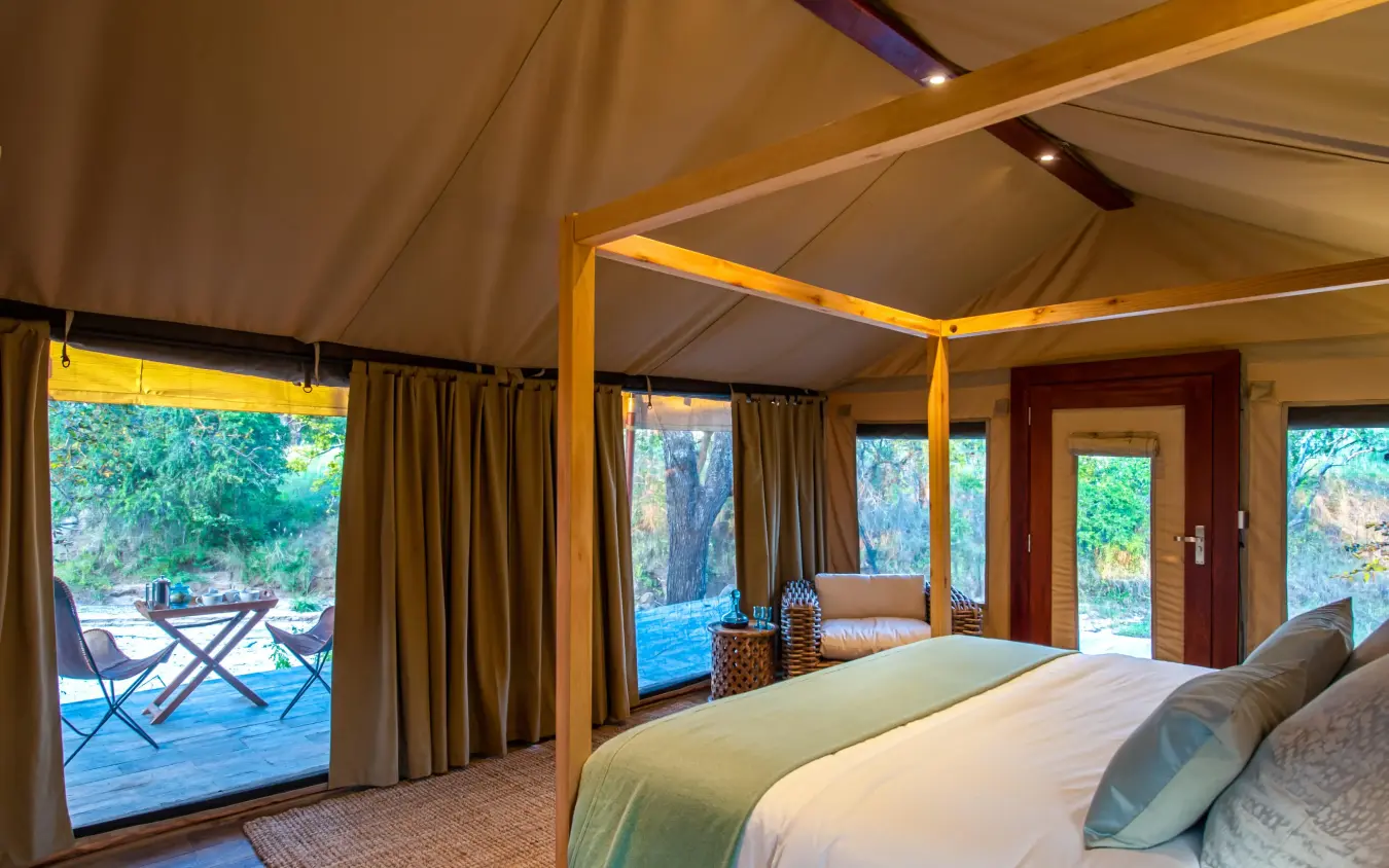 Luxury safari bedroom with canvas walls and lake views, Nimali Tarangire, Tarangire National Park, Tanzania