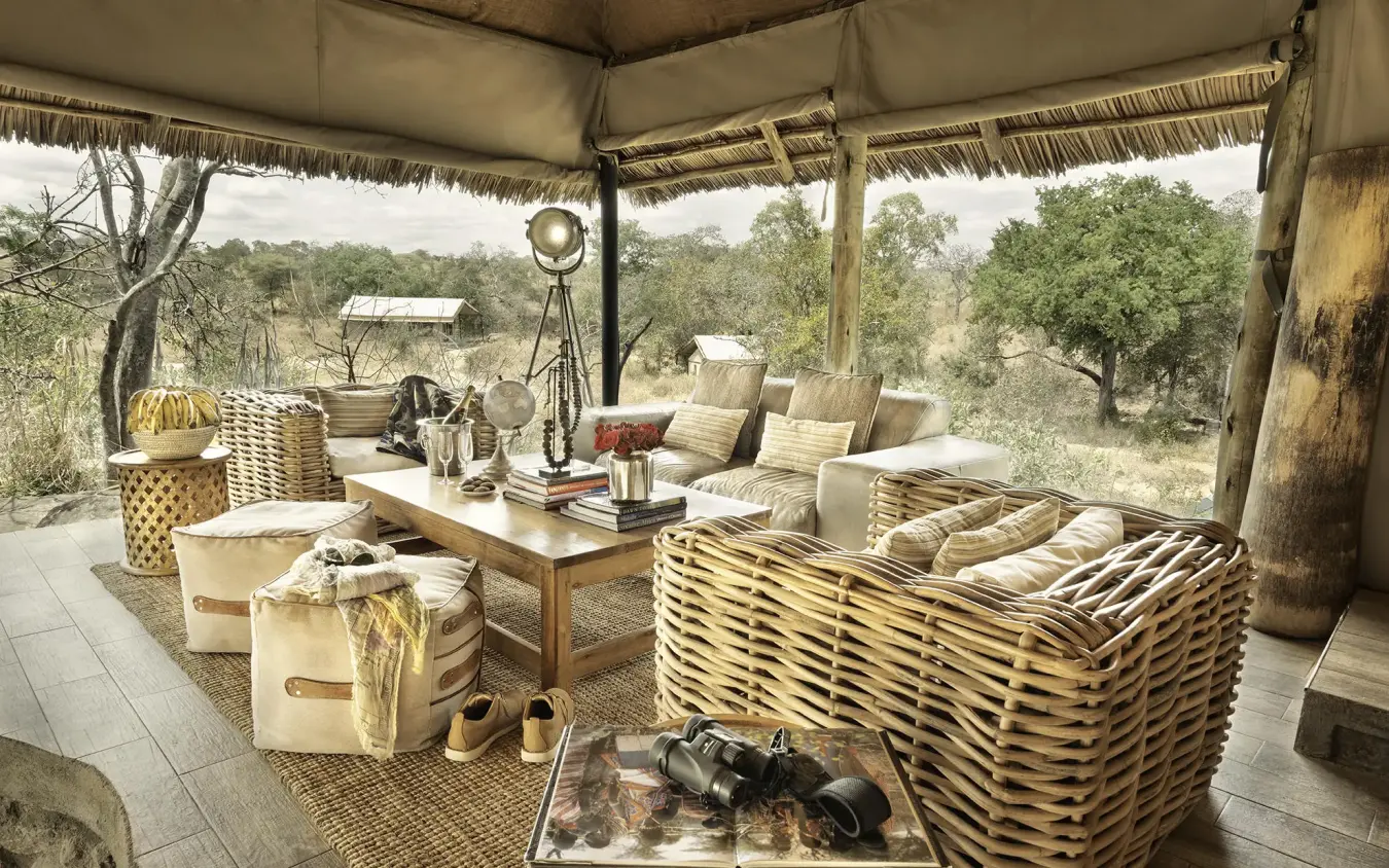 Open-air lounge pavilion with wicker furniture and savanna views, Nimali Tarangire, Tarangire National Park, Tanzania