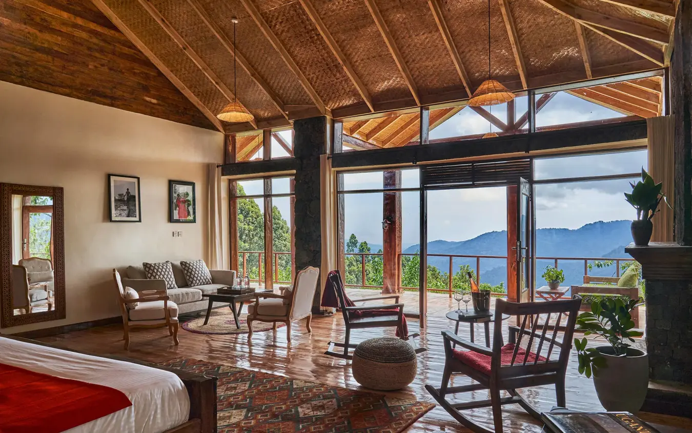 Bedroom suite with expansive windows overlooking lake and mountains, Nkuringo Gorilla Lodge, Bwindi Impenetrable Forest, Uganda