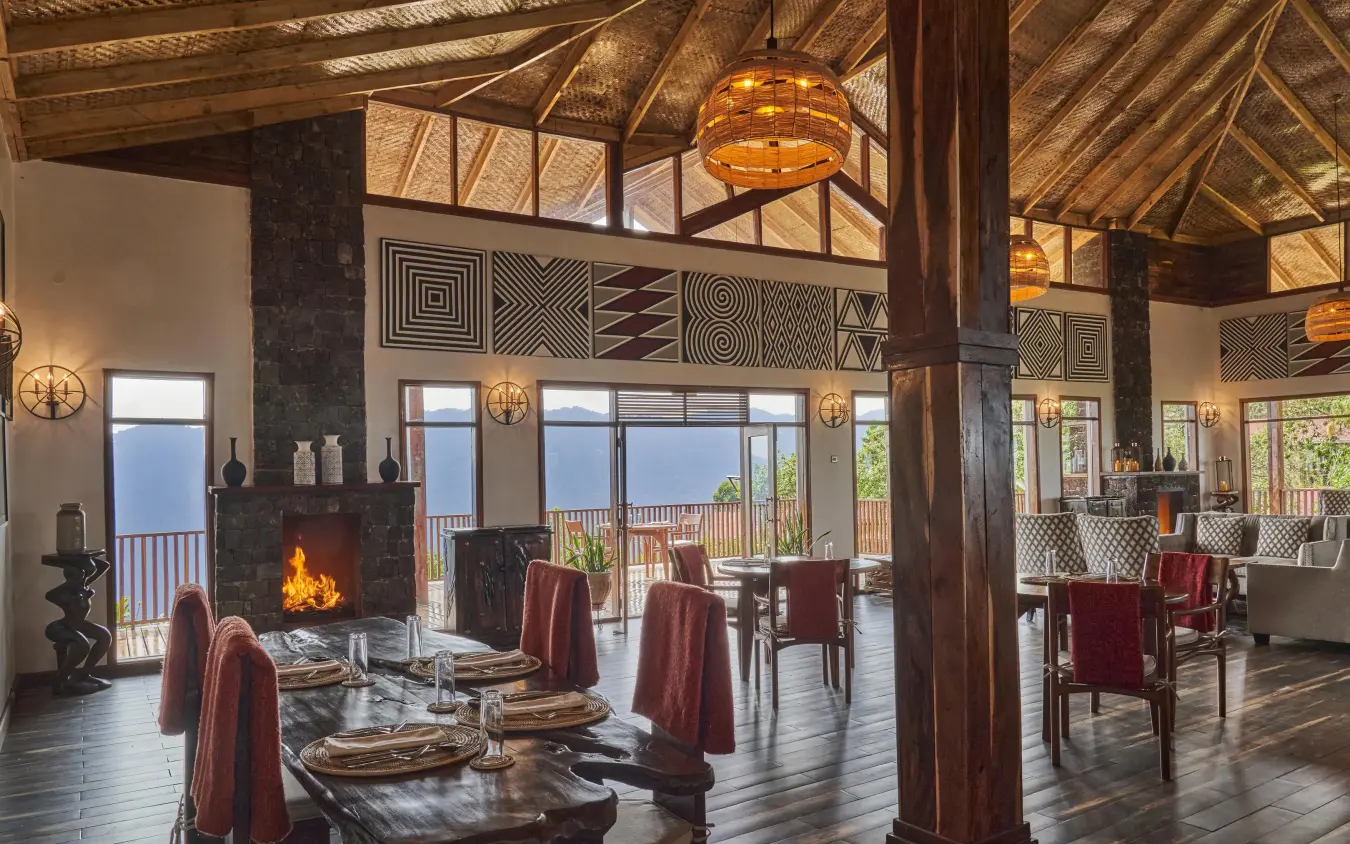Spacious dining room with fireplace and mountain views, Nkuringo Gorilla Lodge, Bwindi Impenetrable Forest, Uganda
