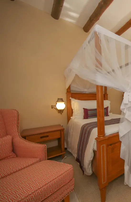 Spacious bedroom with wooden four-poster canopy beds, No.5 Boutique Hotel, Entebbe and Kampala, Uganda