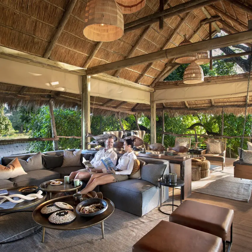 Covered lounge area with seating and thatched roof structure, Nyamatusi Camp, Mana Pools, Zimbabwe