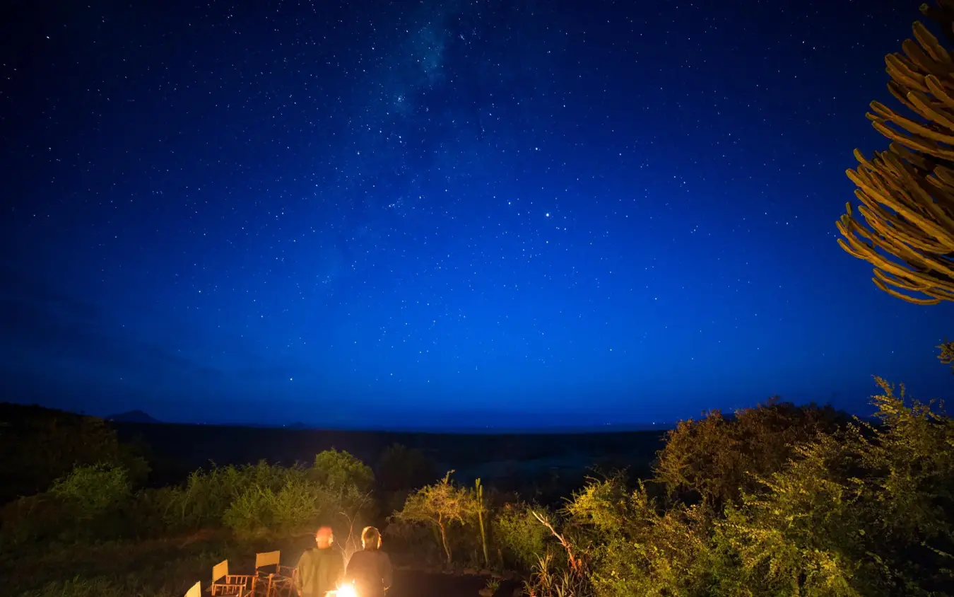 Night sky with stars above safari lodge deck and landscape, Ol Donyo Lodge, Amboseli and Chyulu Hills, Kenya