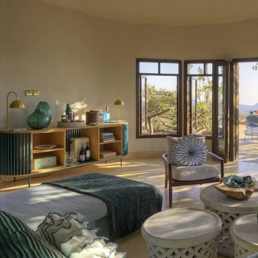 Spacious bedroom suite with expansive windows overlooking landscape, Ol Lentille, Laikipia Highlands, Kenya