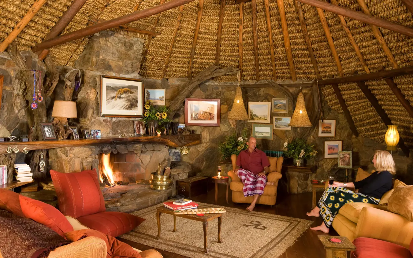 Thatched dome interior with fireplace and seating areas, Ol Malo Lodge, Laikipia Highlands, Kenya