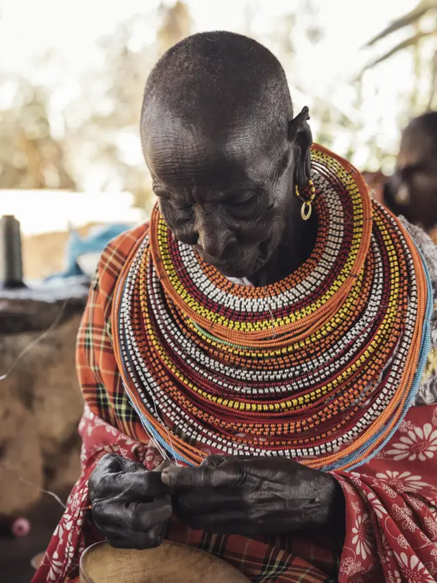 Maasai woman wearing traditional beaded necklaces and clothing, Ol Malo Lodge, Laikipia Highlands, Kenya