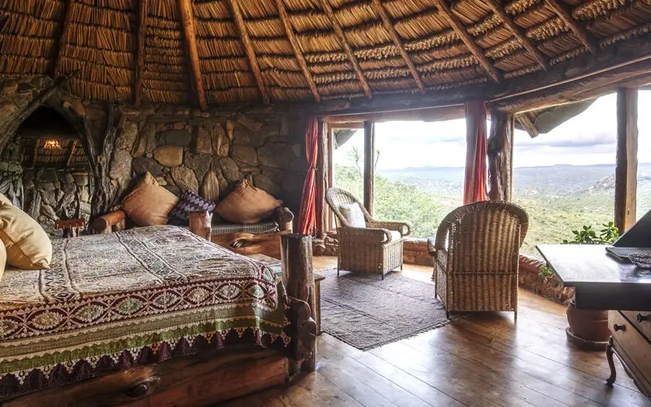 Spacious bedroom with thatched roof and panoramic valley views, Ol Malo Lodge, Laikipia Highlands, Kenya