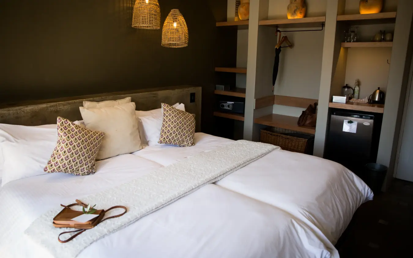 Luxury bedroom with twin beds and woven pendant lighting, Olive Grove Guesthouse, Windhoek, Namibia