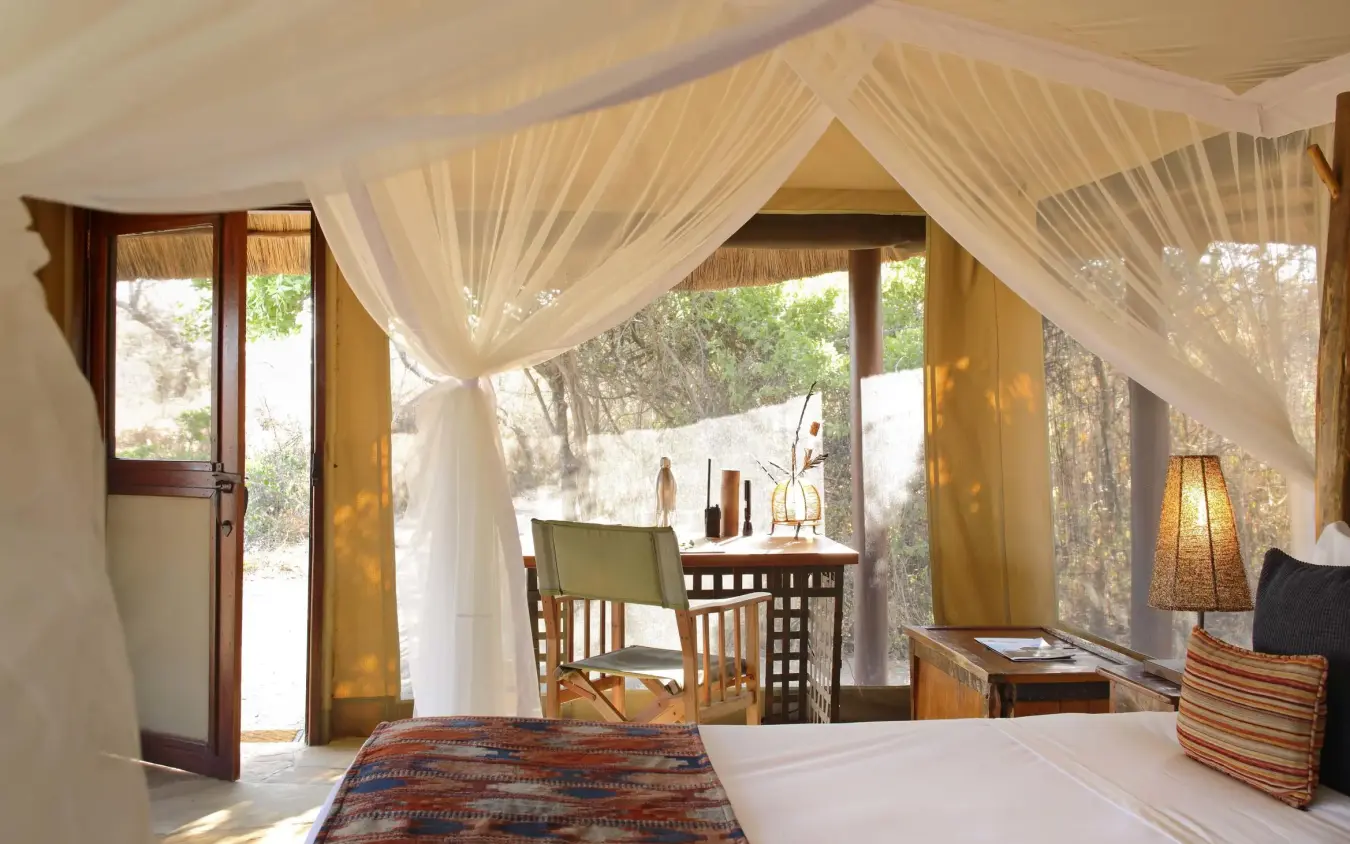 Luxury bedroom with sheer curtains and outdoor views