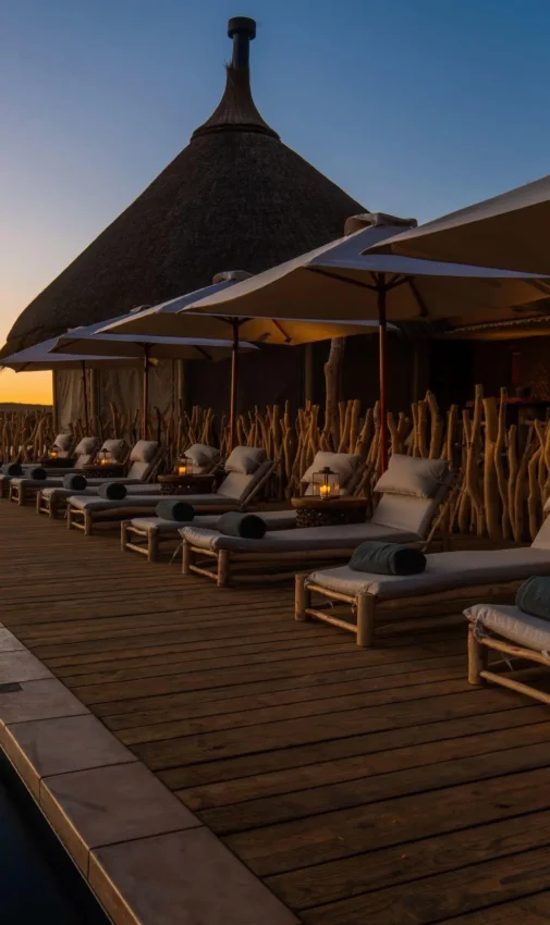 Waterfront wooden deck with loungers at sunset, Omaanda, Windhoek, Namibia