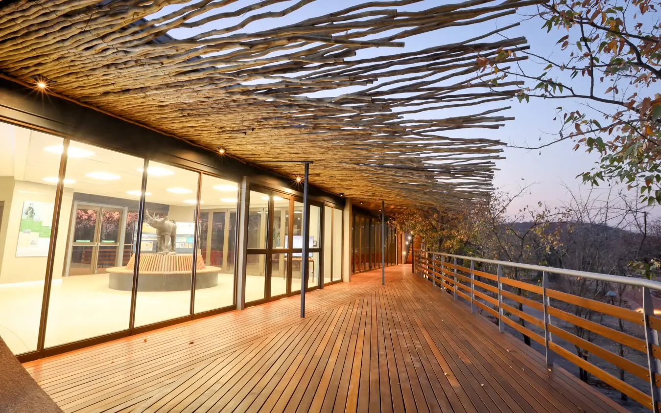 Modern wooden deck with panoramic valley views and rustic timber pergola, Ongava Lodge, Etosha National Park, Namibia