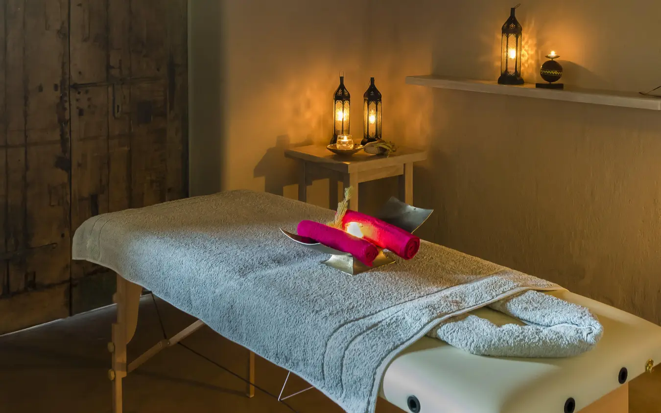 Spa massage bed with towels and decorative flowers, Onguma The Fort, Etosha National Park, Namibia