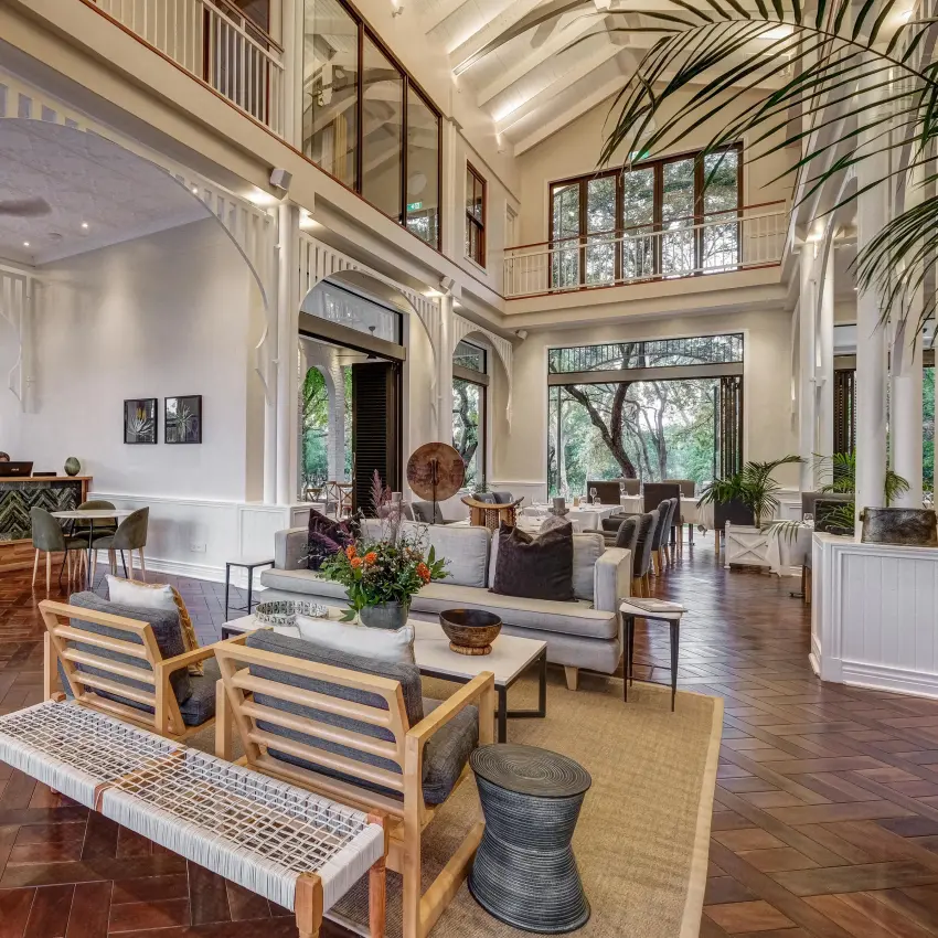 Spacious open-plan lounge with high ceilings and natural light, Palm River Hotel, Victoria Falls, Zimbabwe