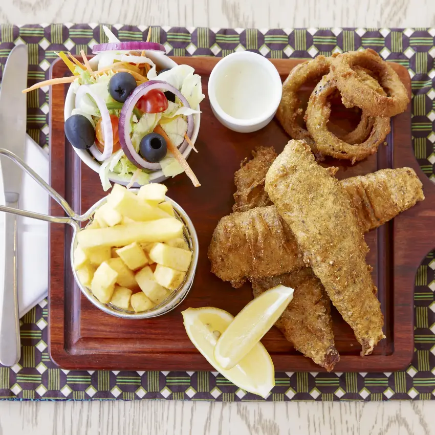Plated fried fish with chips and fresh salad, Pioneers Lodge, Victoria Falls, Zimbabwe