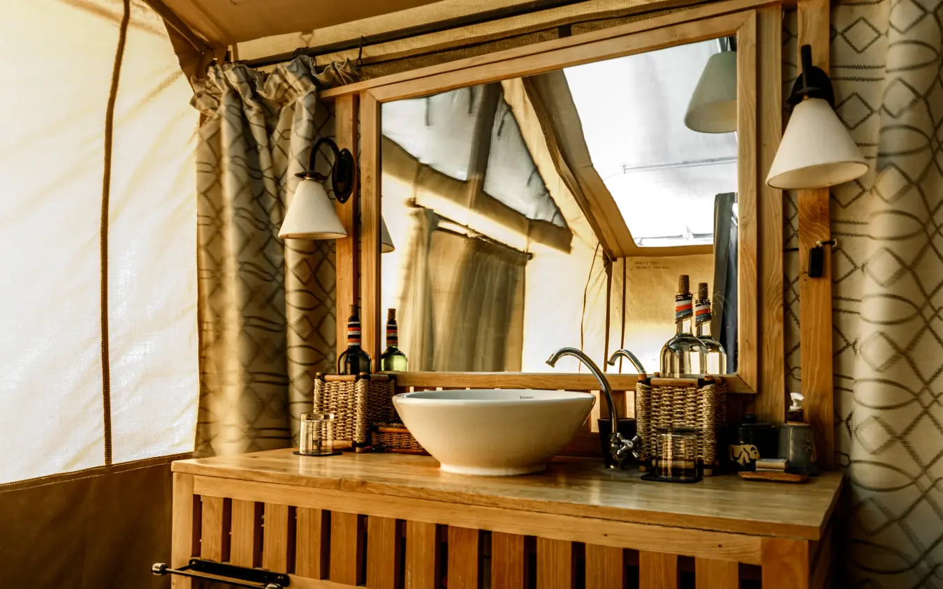 Glamping tent bathroom with vessel sink and wooden vanity, Porini Amboseli Camp, Amboseli and Chyulu Hills, Kenya