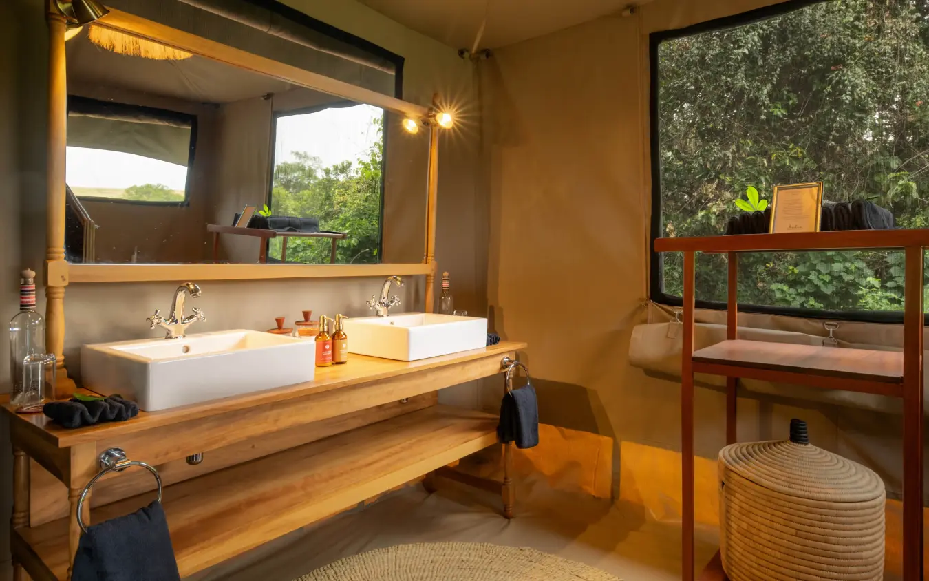 Bathroom with double sink vanity and forest views, Rekero Camp, Maasai Mara, Kenya