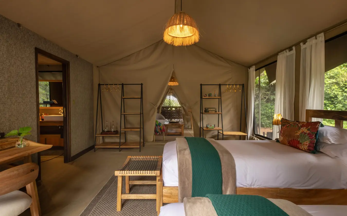 Luxury tent bedroom with twin beds and natural light, Rekero Camp, Maasai Mara, Kenya