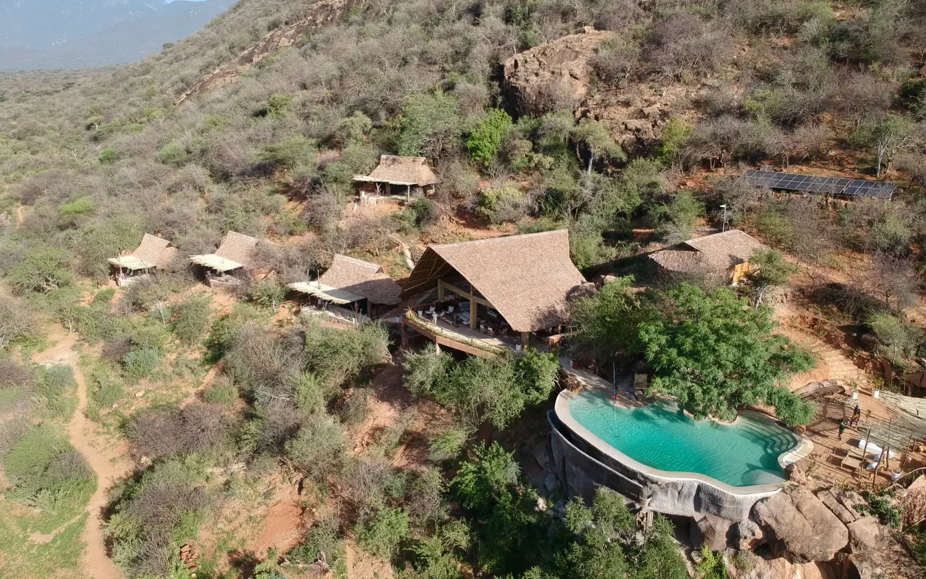 Aerial view of safari lodge nestled among acacia trees with pool, Reteti House, Northern Kenya, Kenya