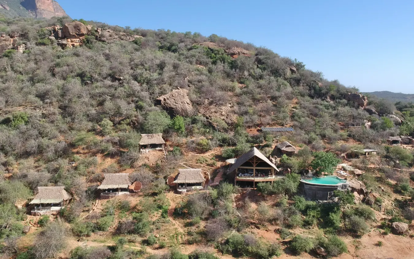 Safari lodge nestled on hillside with pool and rock outcroppings, Reteti House, Northern Kenya, Kenya