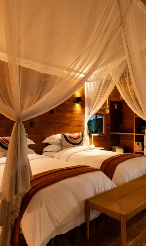 Luxury bedroom with four-poster canopy beds and wooden architecture, The Retreats at Sayari Camp, Serengeti National Park, Tanzania