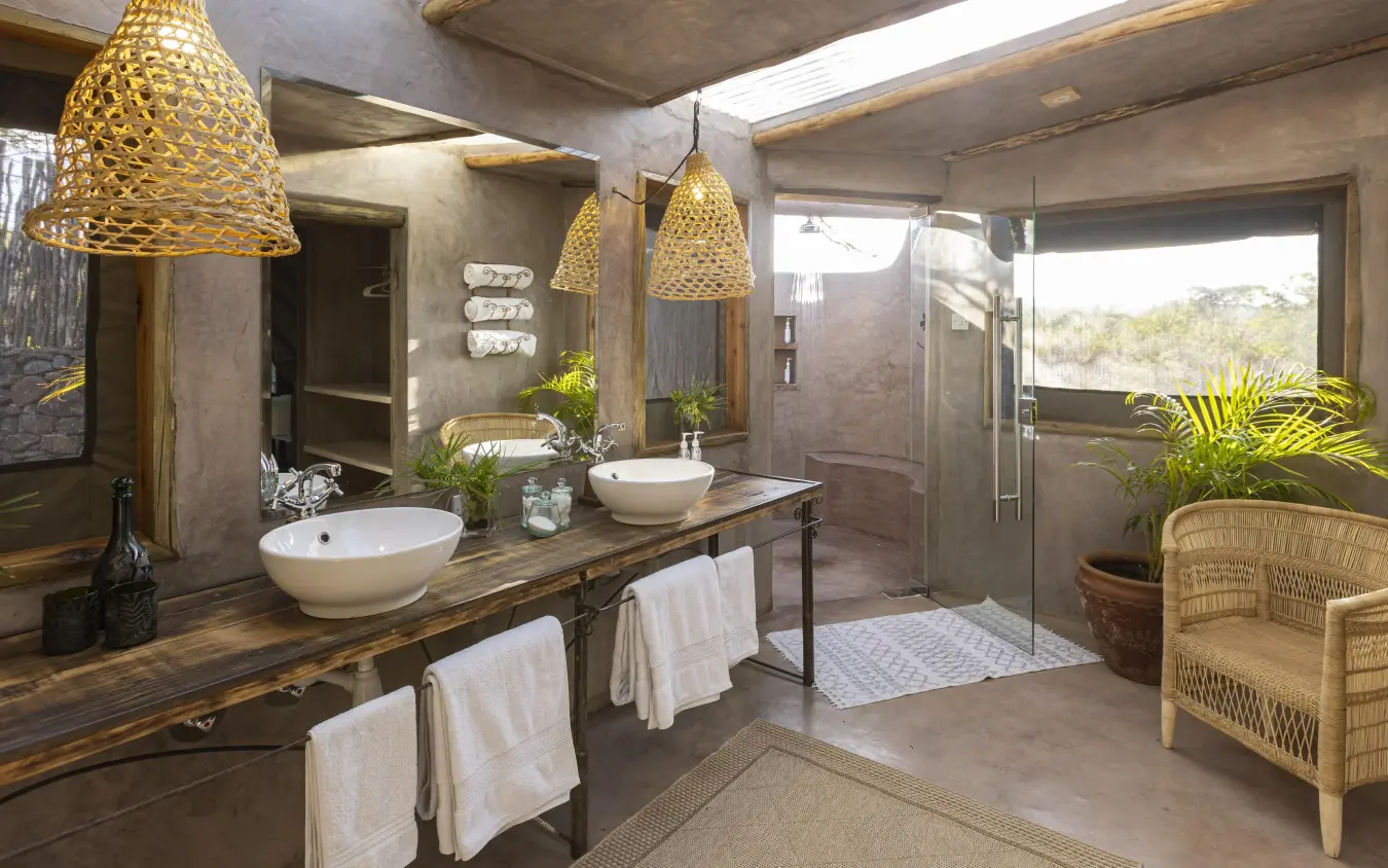Spa-style bathroom with double vessel sinks and rainfall shower, Richard’s River Camp, Maasai Mara, Kenya