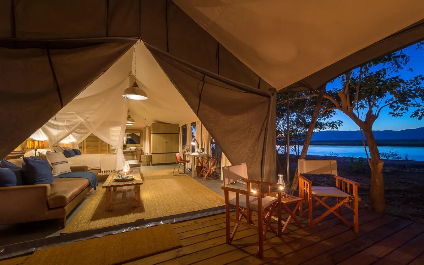 Luxury safari tent with lake view at dusk, Ruckomechi Camp, Mana Pools, Zimbabwe