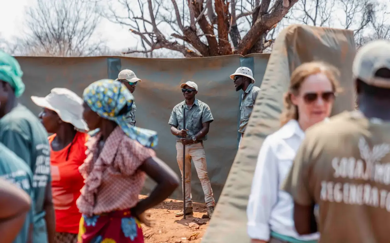 Community gathering with local residents in village setting, Sable Valley Lodge, Hwange National Park, Zimbabwe