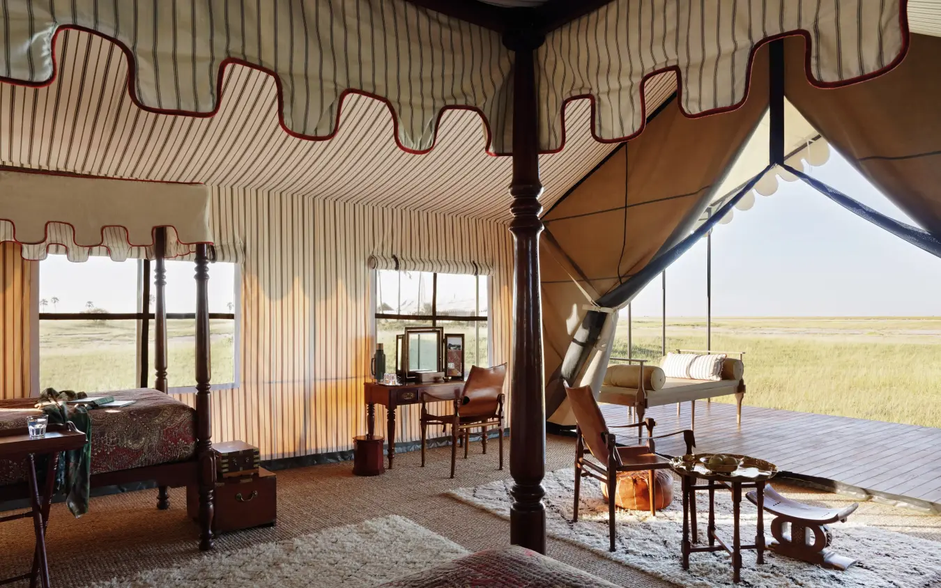 Interior of luxury safari tent with open sides and landscape views, San Camp, Makgadikgadi Pans, Botswana
