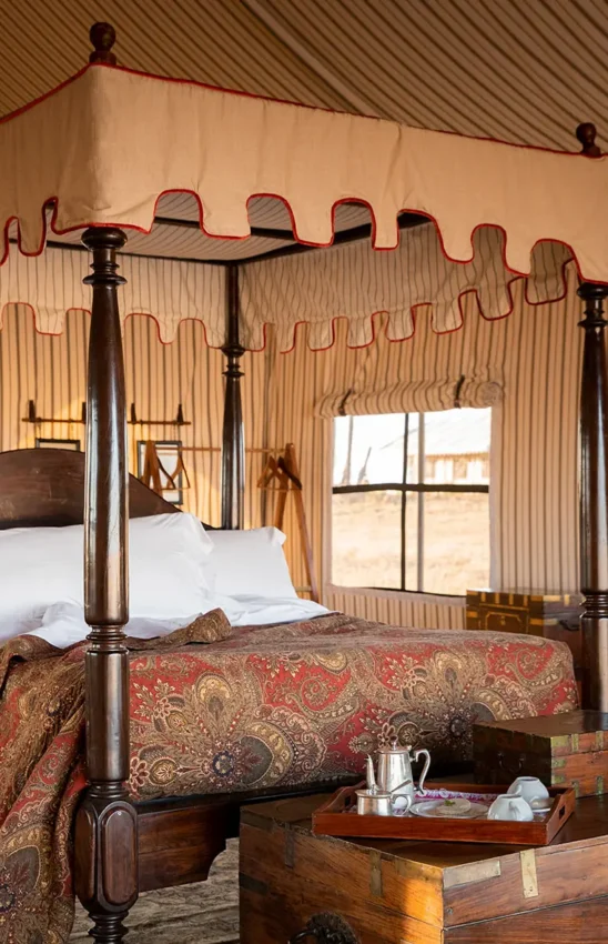 Four-poster bed in canvas safari tent with windows, San Camp, Makgadikgadi Pans, Botswana