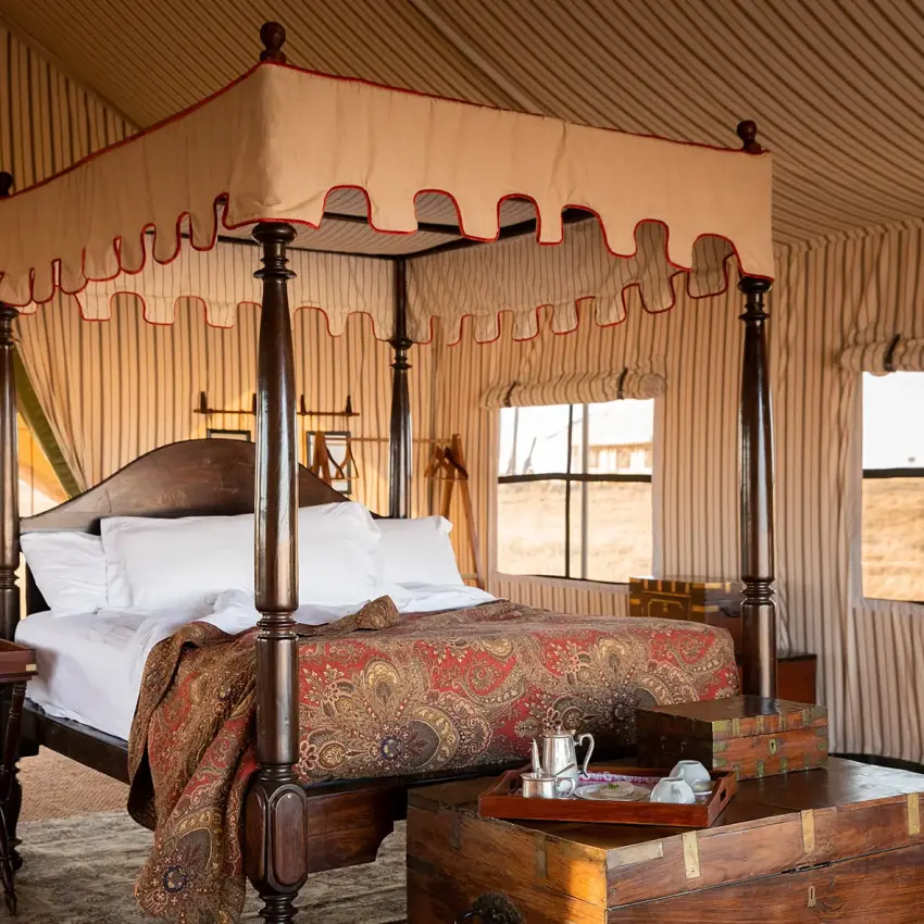 Four-poster bed in canvas safari tent with windows, San Camp, Makgadikgadi Pans, Botswana
