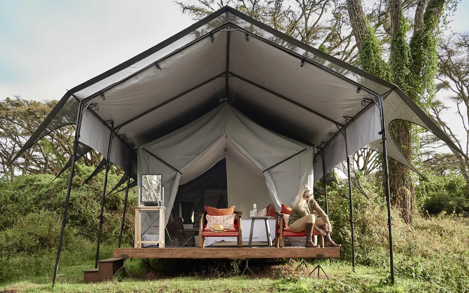 Canvas safari tent with wooden deck and furnishings, Sanctuary Crater Camp, Ngorongoro Crater, Tanzania