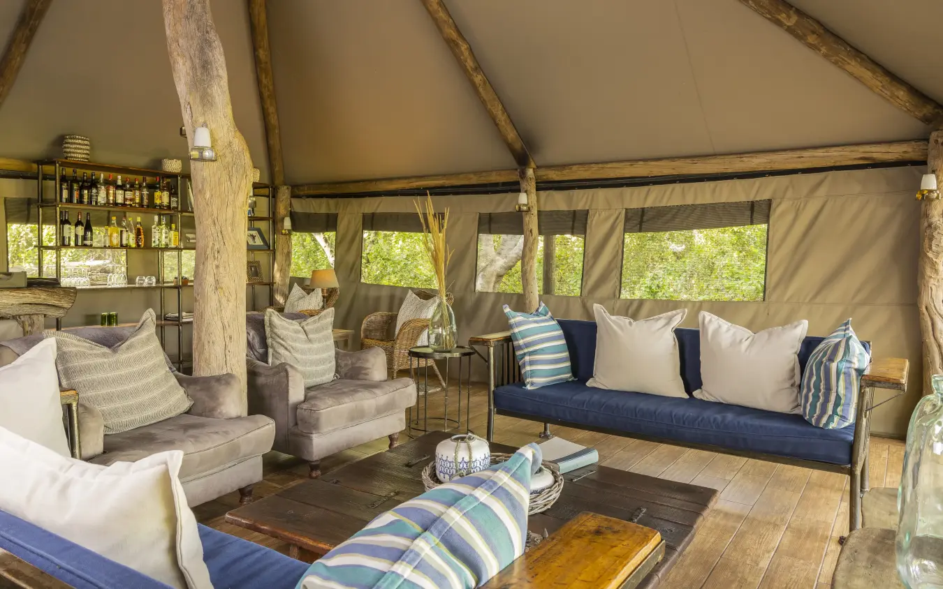 Luxury safari tent interior with canvas walls and wooden furnishings, Sango Expedition Camp, Gonarezhou & Malilangwe, Zimbabwe