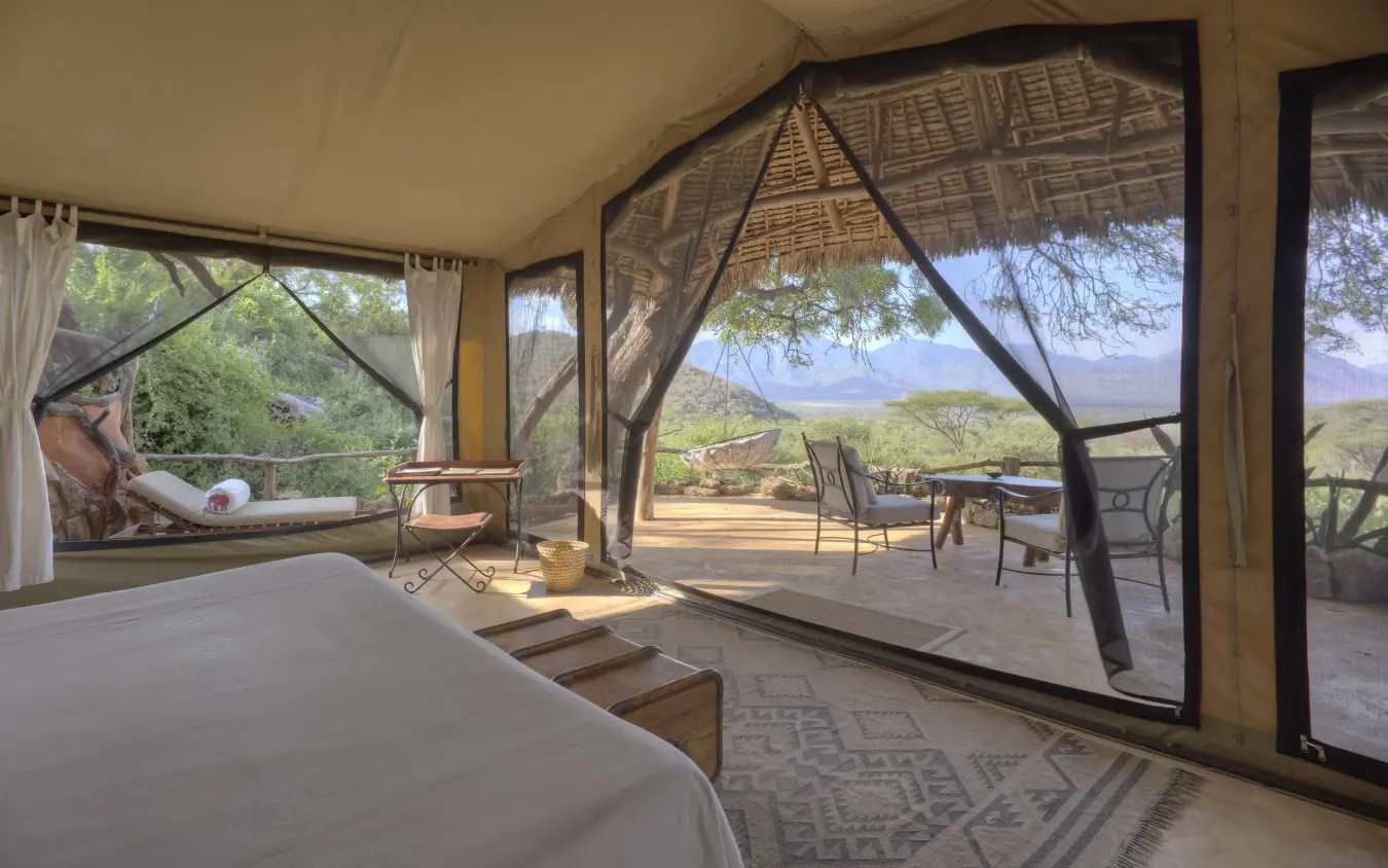 Bedroom with expansive views of African savanna landscape, Sarara Camp, Northern Kenya, Kenya