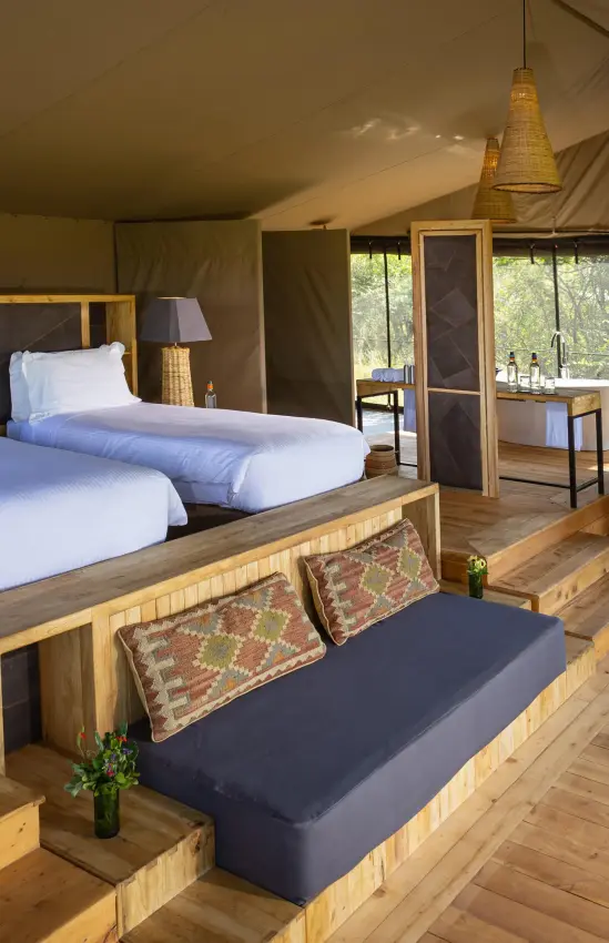 Spacious safari tent bedroom with twin beds and windows, Eagle View Camp, Maasai Mara, Kenya
