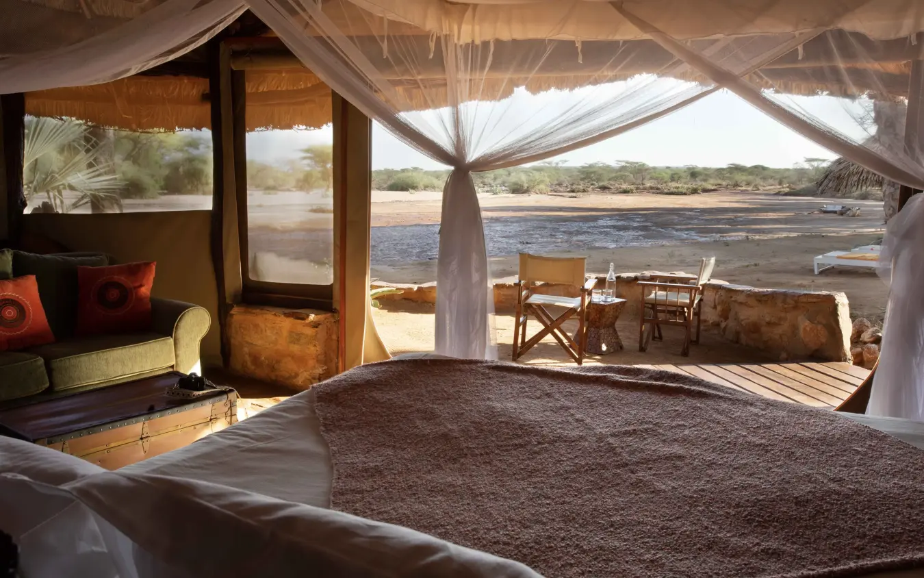 Riverside safari lodge bedroom with river views and sheer curtains, Saruni Rhino, Northern Kenya, Kenya