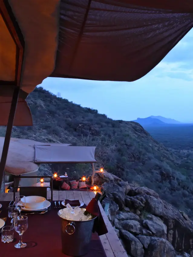 Dining deck overlooking vast desert landscape at dusk, Saruni Samburu, Samburu Reserve, Kenya