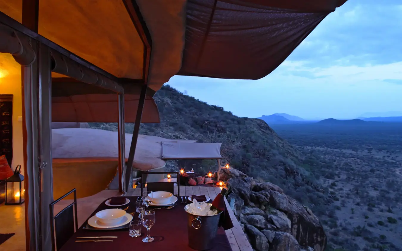 Dining deck overlooking vast desert landscape at dusk, Saruni Samburu, Samburu Reserve, Kenya