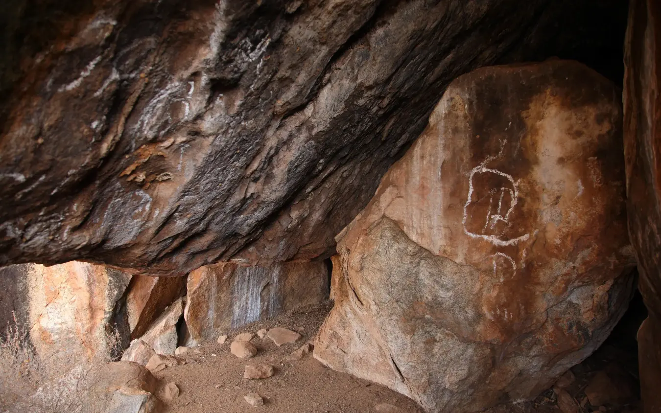 Ancient rock art and petroglyphs on cave wall, Saruni Samburu, Samburu Reserve, Kenya